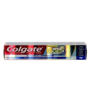 A tube of colgate total toothpaste on top of a counter.