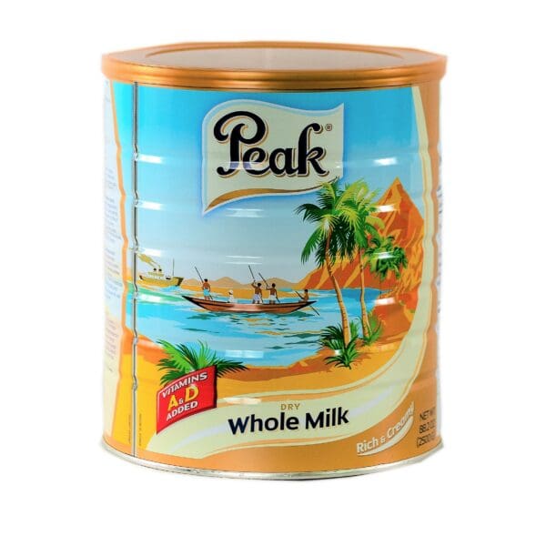 A can of whole milk with palm trees on it.