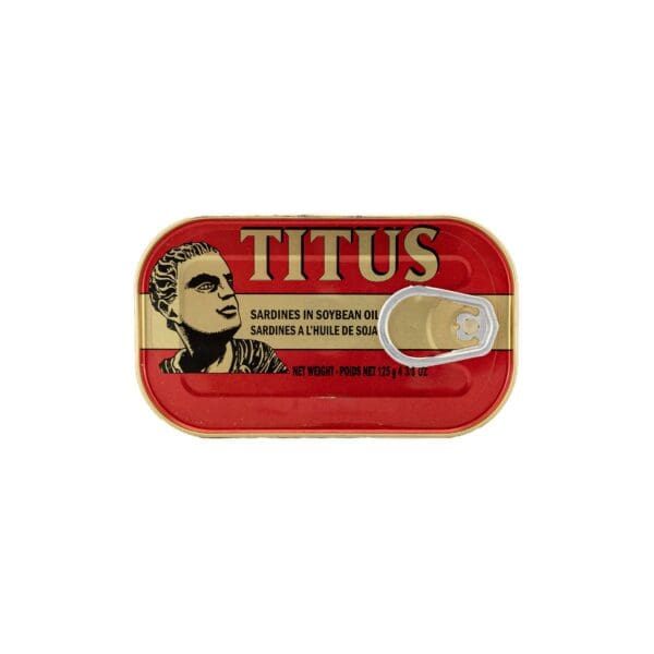 A red tin of titus with a man 's face on it.